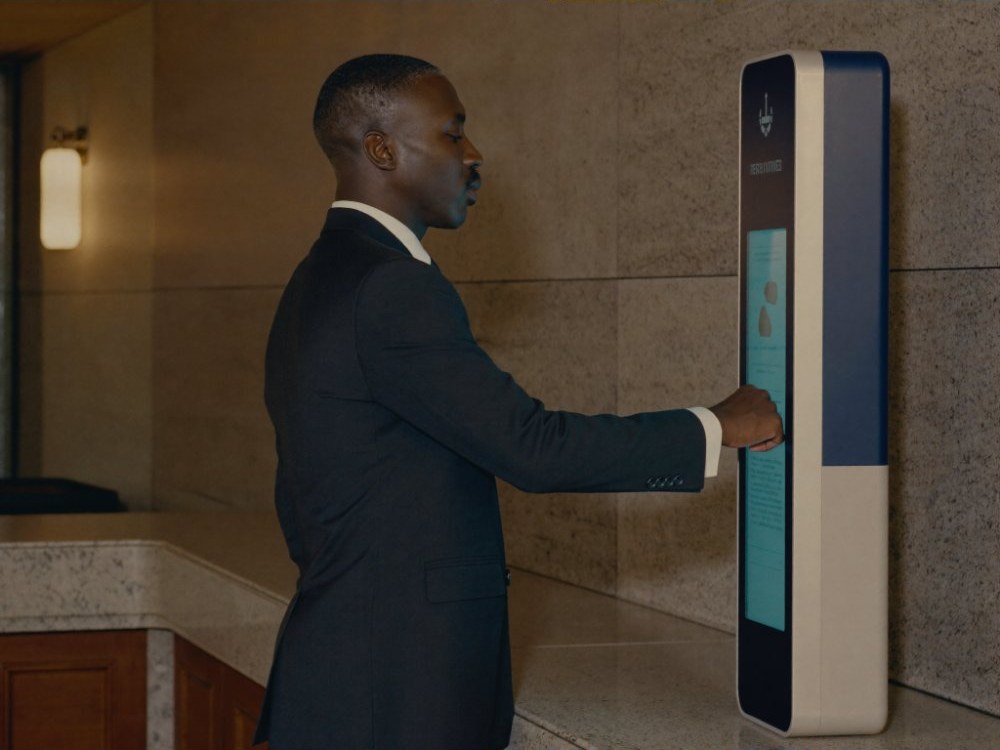 A visitor verifying his identity at a government building kiosk